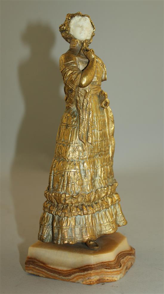 Rene Paul Marquet (French, 1879-1939). A gilt bronze and ivory figure of a lady wearing a bonnet, 10.25in.